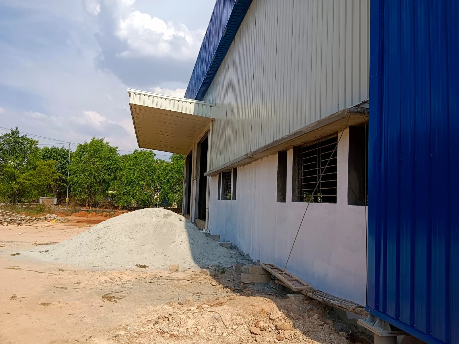 Warehouse entrance canopy and loading bay with finished plaster