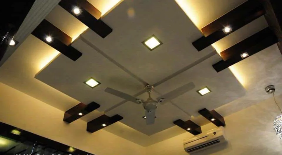 Dark wooden beam false ceiling with square panel lights