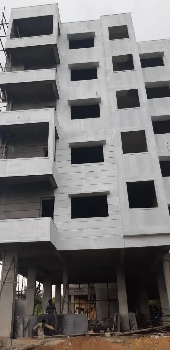 Full-height building facade with ground-floor construction work