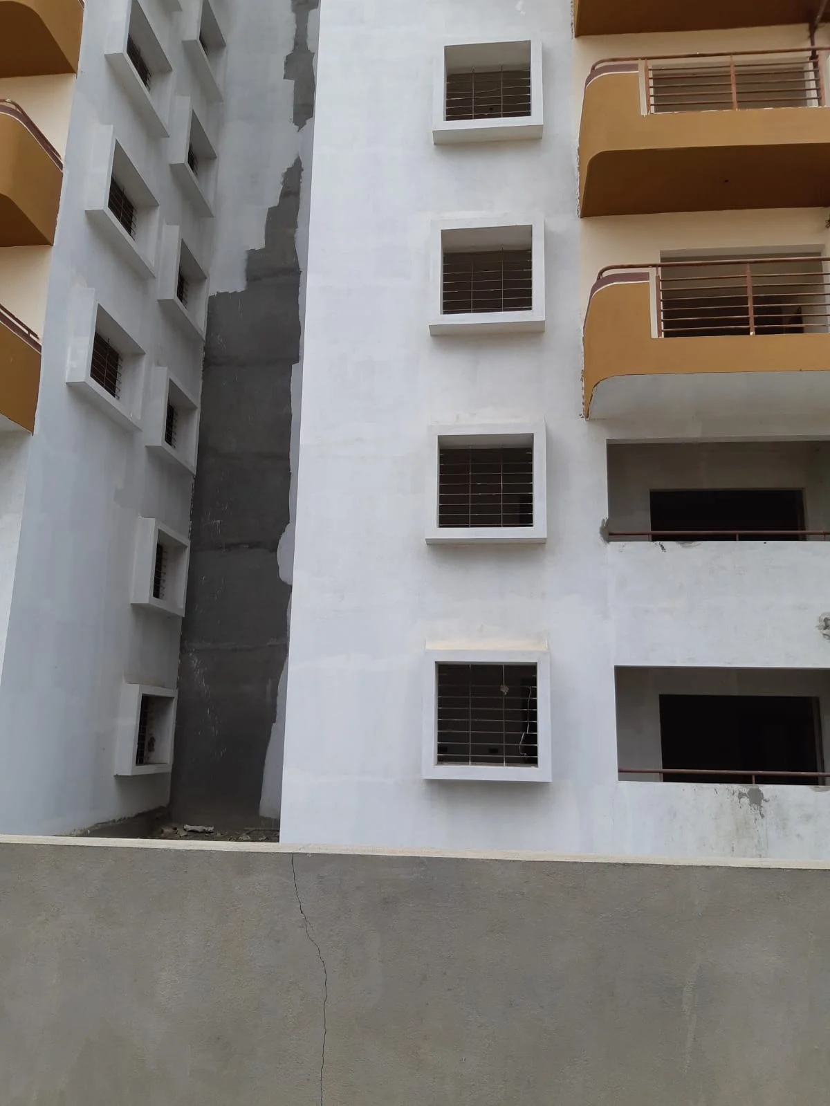 Building courtyard with balconies and exterior finishing in progress
